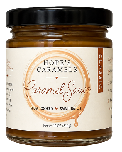 A 10-oz jar of Hope's Caramels Classic Caramel Sauce with a black lid and cream-colored label, set against a plain white background.