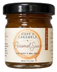 A jar of Hope's Caramels Classic Caramel Sauce, 1 oz, featuring a cream-colored label with brown and black text, set against a plain white background.