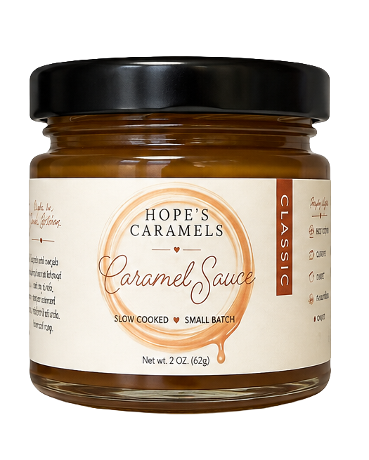 A jar of Hope's Caramels Classic Caramel Sauce with a black lid and cream label, set against a plain white background.